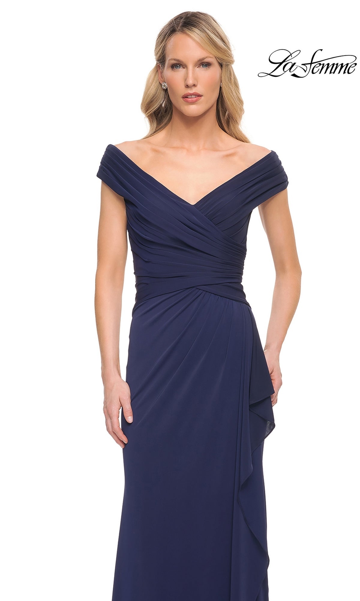 Woman in an off-the-shoulder, v-neck, navy blue “Long Formal Dress: La Femme 30040” with ruching detail stands against a plain white background. “La Femme” logo at top right.